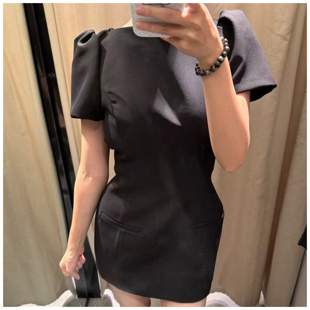 Women's black short puff sleeve mini dress with a stylish boat neckline design and pocket details, suitable for elegant occasion