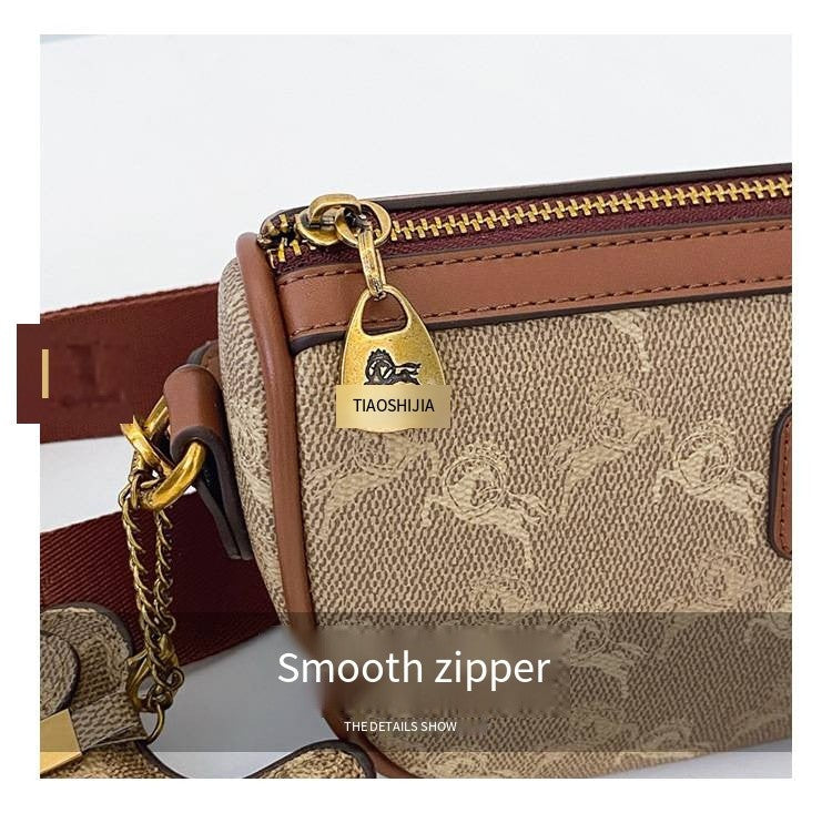 Classic style handbag with strap, featuring a shoulder-sling design, suitable for women, with a bag shape resembling