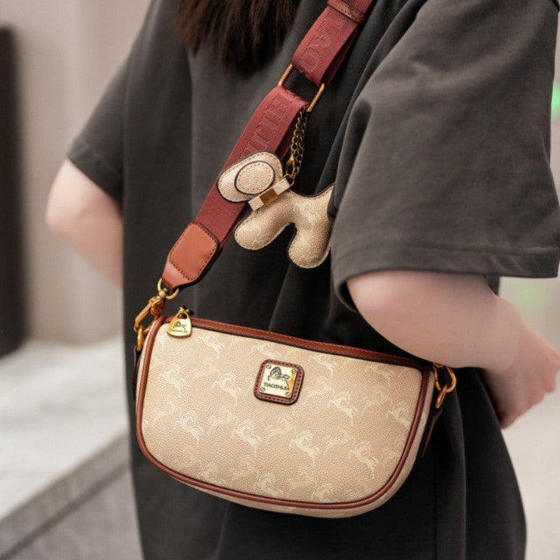 Classic style handbag with strap, featuring a shoulder-sling design, suitable for women, with a bag shape resembling