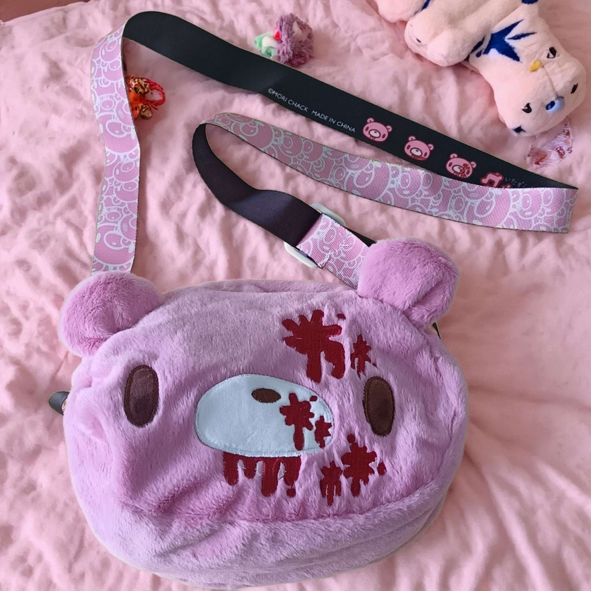 Gloomy Bear plush crossbody bag: Pink, cute - edgy with “blood - splatter” details. A fun, unique pick for fans.