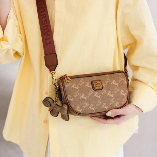 Classic style handbag with strap, featuring a shoulder-sling design, suitable for women, with a bag shape resembling
